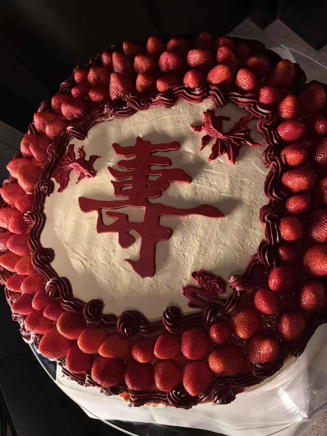 Completed large-format strawberry celebration cake