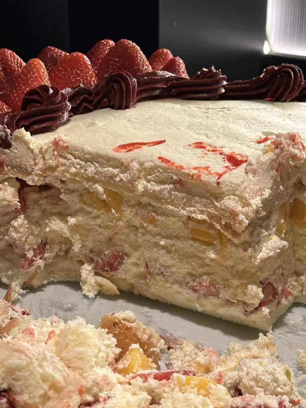 Cut detail showing the layers of a large-format celebration cake